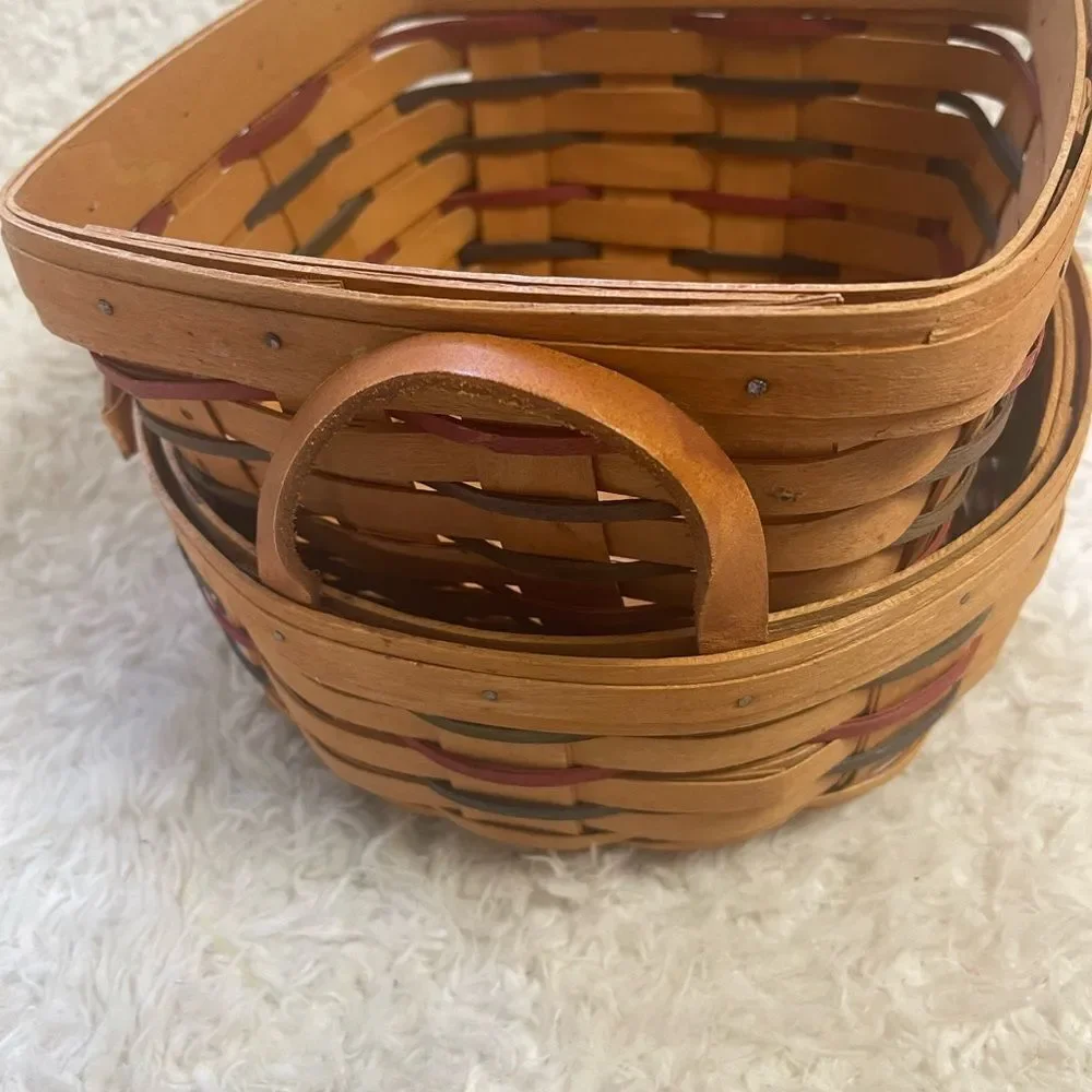 Longaberger 1995 set of two Handcrafted round and Square Woven baskets .